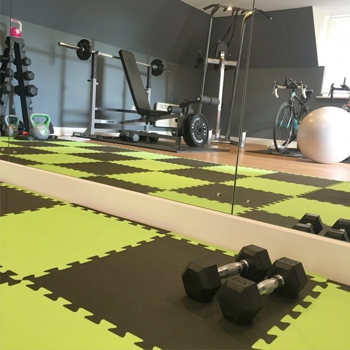 Home gym fitness equipment with weights and mats