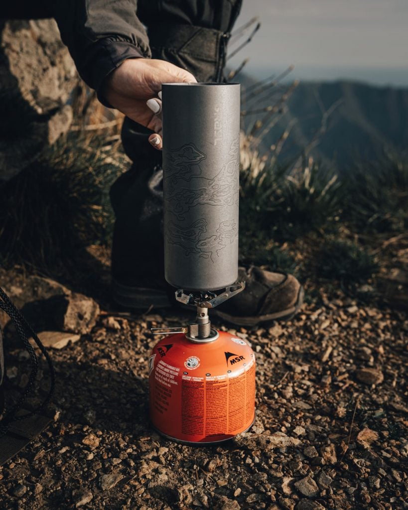 Grayl Ultrapress Titanium used with a camp stove credit Alex Wander @primitive wanderer