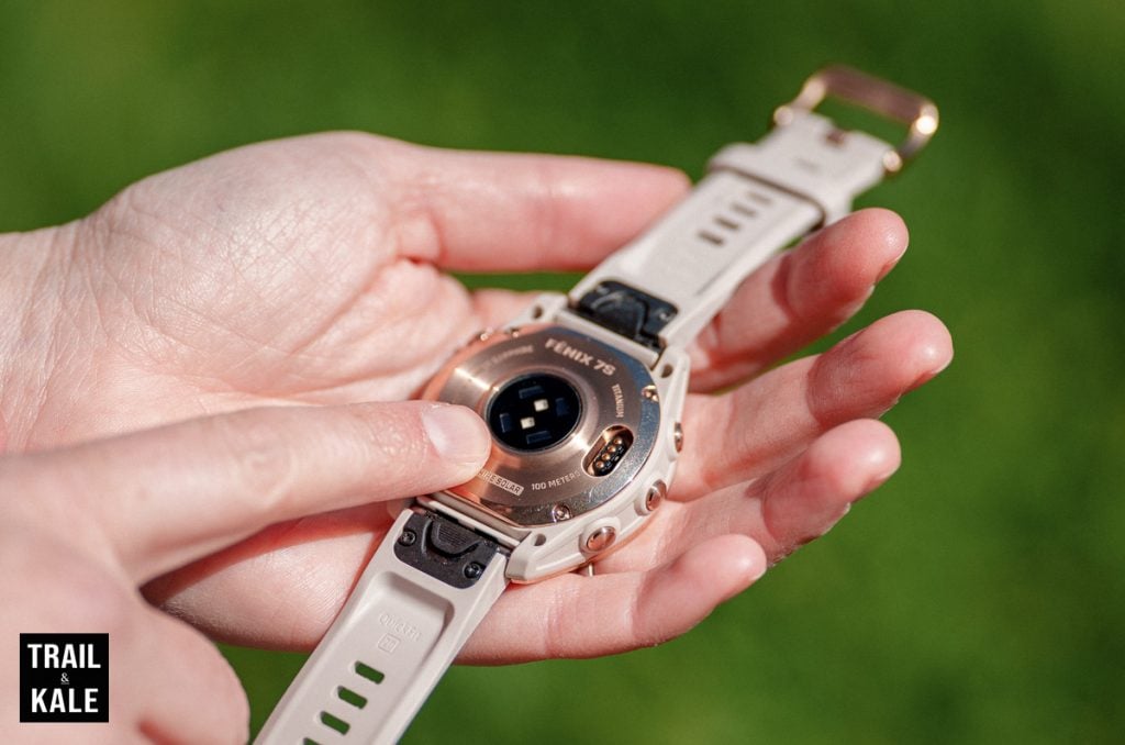 The wrist heart rate monitor on a Garmin Fenix 7S running watch.