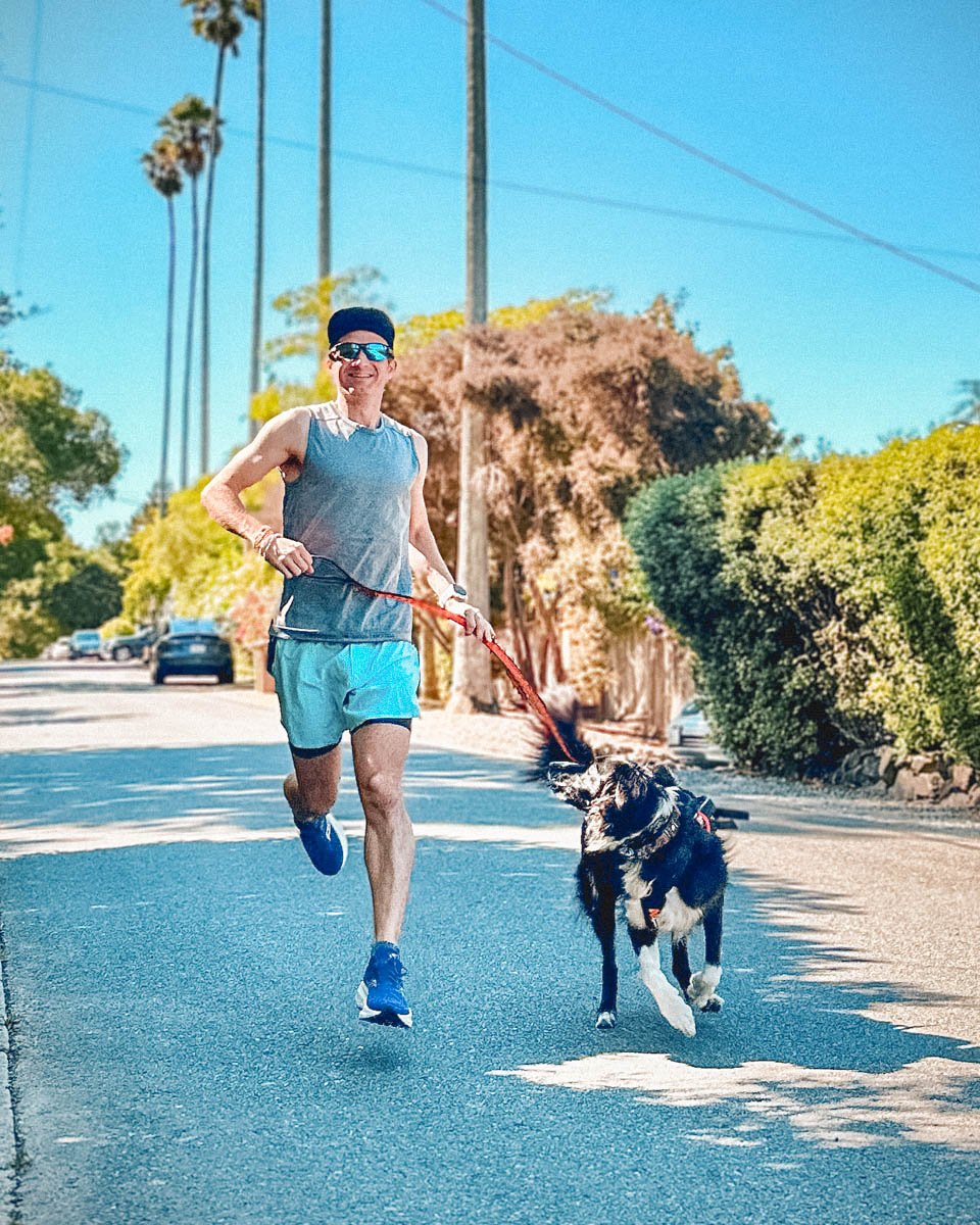 Alastair running with Kepler in Lululemon road to trail shorts 1