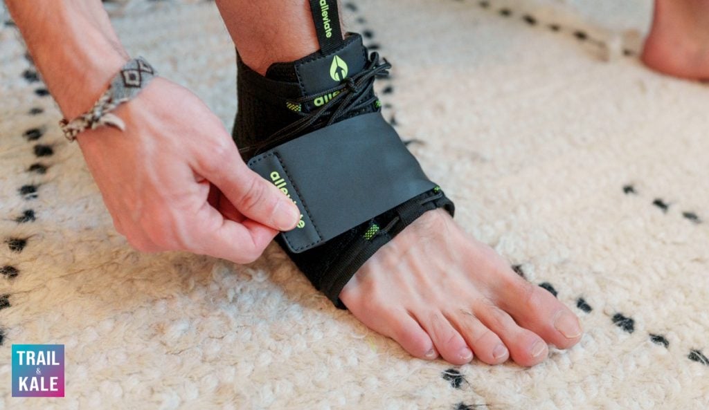Putting on the Alleviate Therapy plantar fasciitis brace with velcro